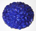 ceramic sculpture of geometric sphere blue one side orange other side