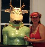 Antonia ( Tuppy) Lawson, bay area ceramic sculptor with her Ceramic sculpture of Holy Cow, Vishnu's Nandi. Anthropomorphic sculpture from the Kitchen God Series