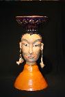Ceramic sculpture of Karma with gold lefed bowl on head inspired bu buddha 